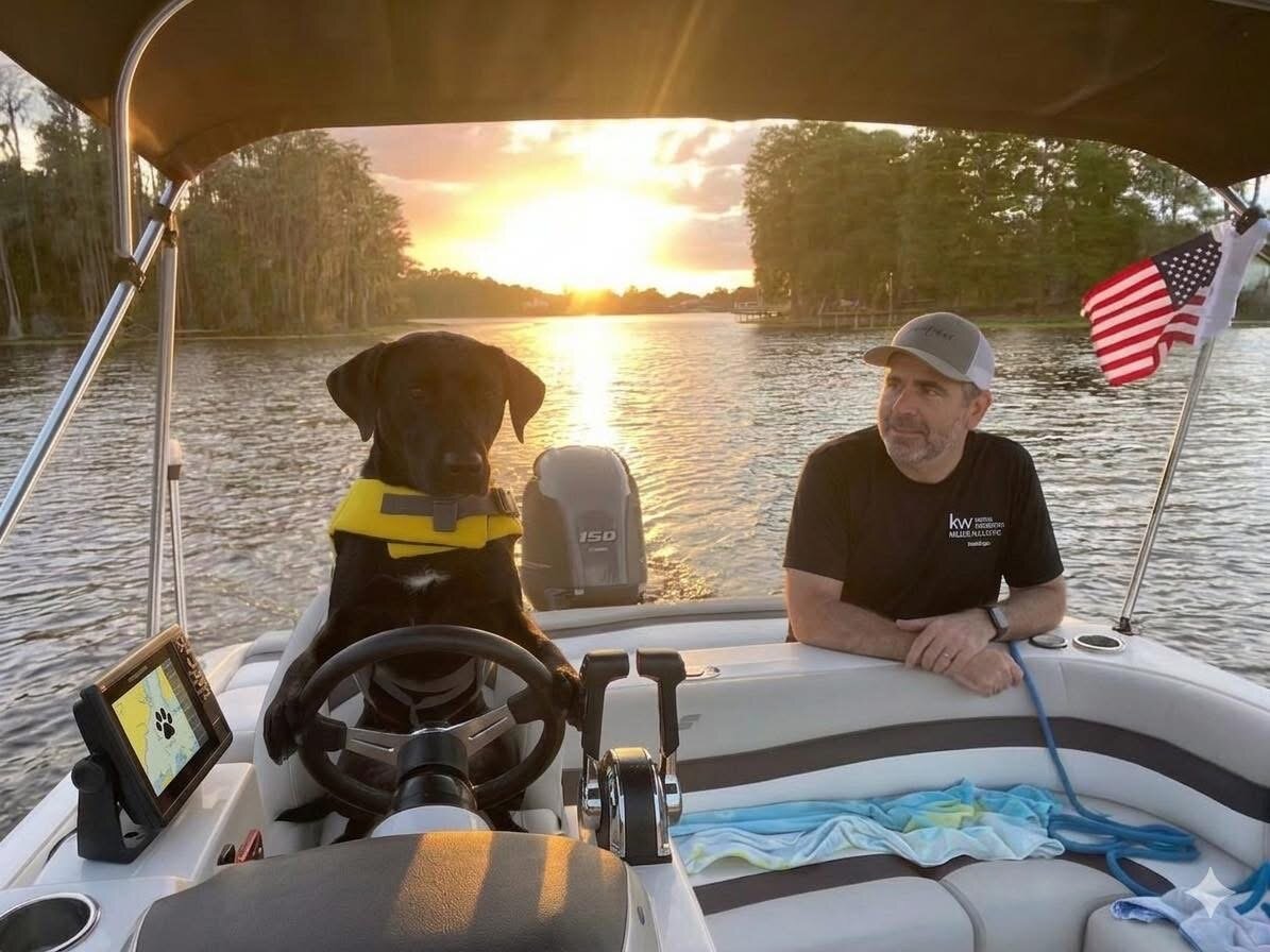 Terence Doohen on his boat with his dog at sunset